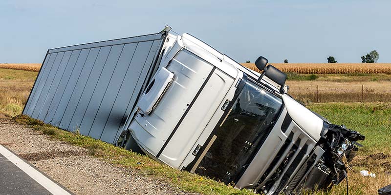 A Overturned Semi Trailer on the side of the road
