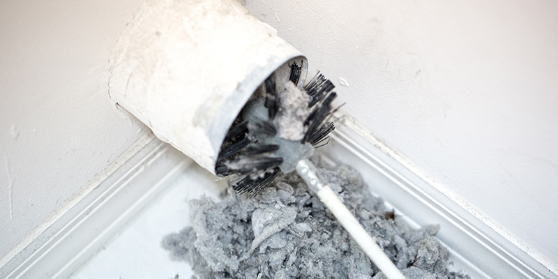 Cleaning dryer vent lint with brush