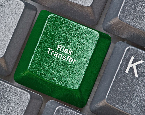 keyboard with green key that says risk transfer
