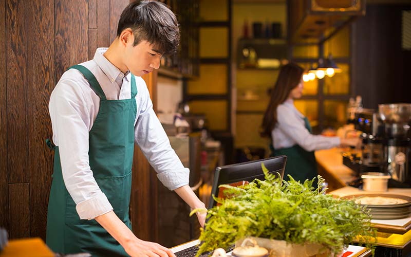 portrait waitress and waiter in cafe