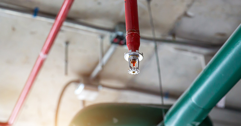 Close-up fire sprinkler on the ceiling for fire detection and alarm system equipment in building safety security protect and prevent or prevention when heat or flame detector is alert