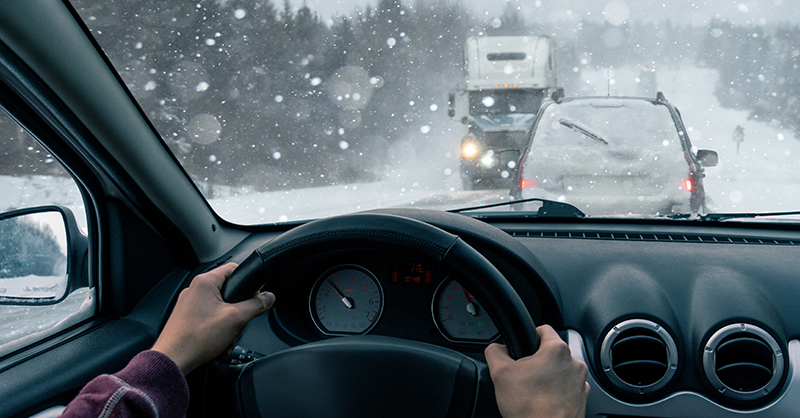 Commercial car driving in snow and ice