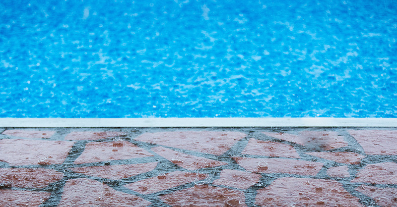 Raindrops falling in swimming pool