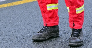 Red cross worker cleaning up after wildfire