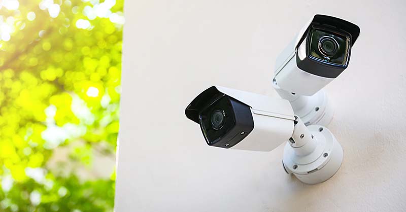 Surveillance camera protecting building