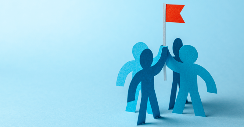 four characters holding red flag