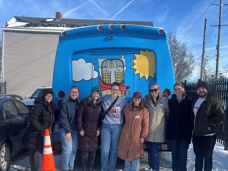 Group of individuals standing together outside