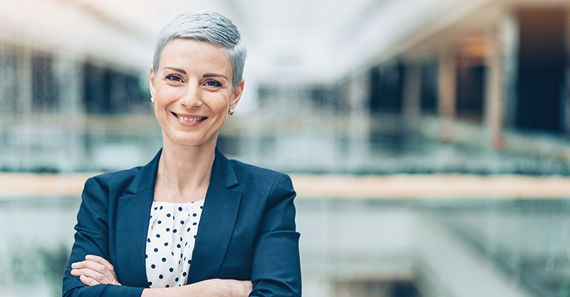 Lady smiling with arms folded