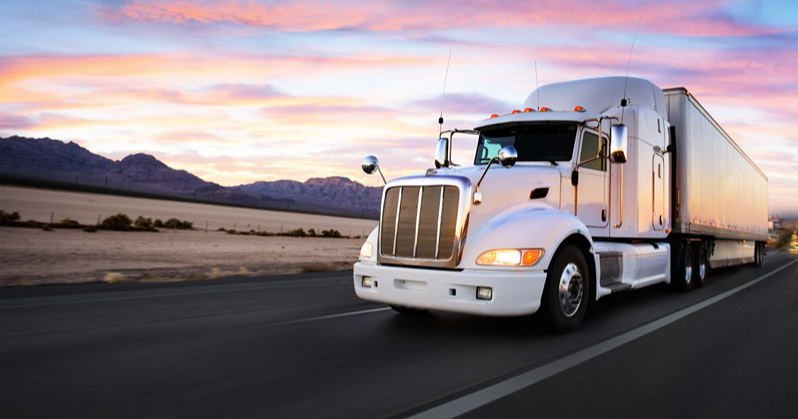 Cargo truck driving on desert highway