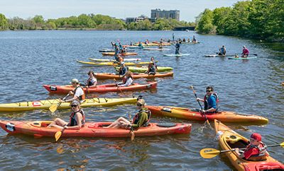 Rowers in canoes on Mystic River